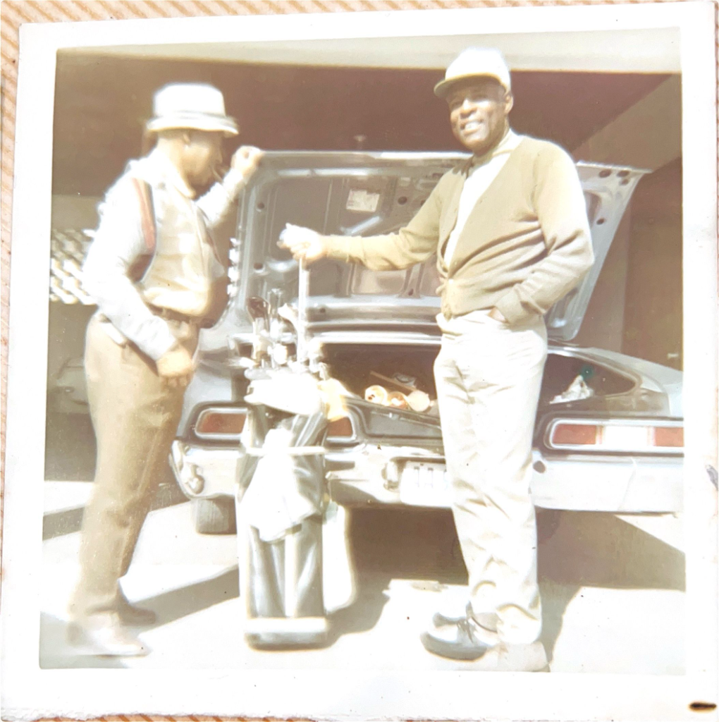 E.B. Mitchell loading golf clubs